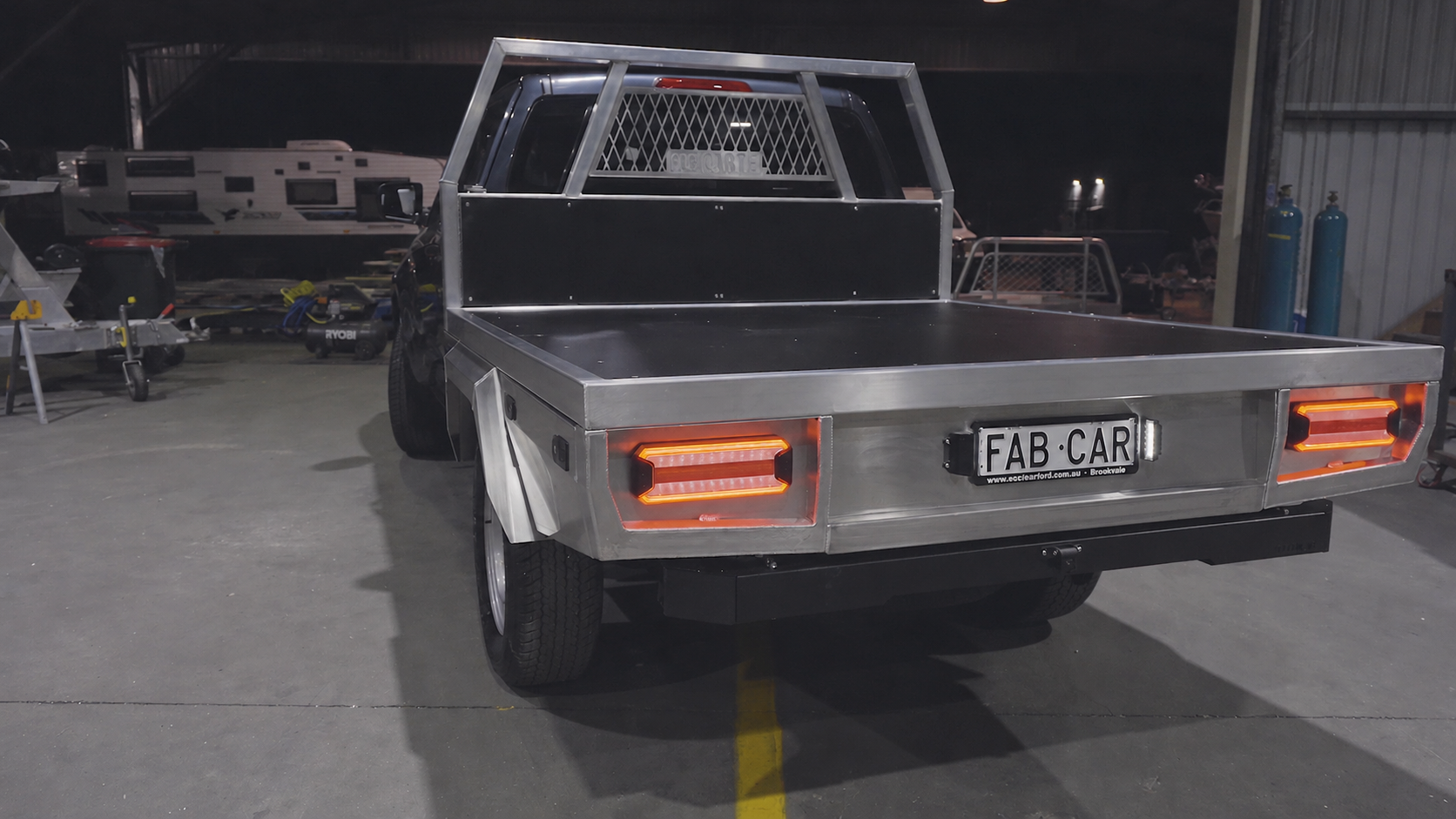 Finished raw aluminium FAB CARTEL ute tray with LED tail lights